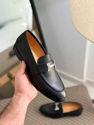 Hermès Paris Loafer, featuring a signature "H" buckle and goatskin leather construction.