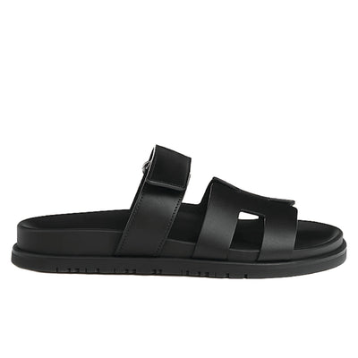 Hermès Chypre sandals in black calfskin leather.